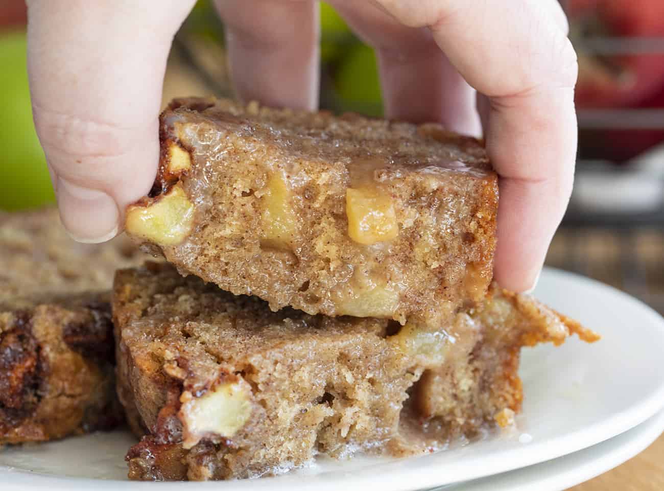 Hand Picking Up Apple Fritter Bread