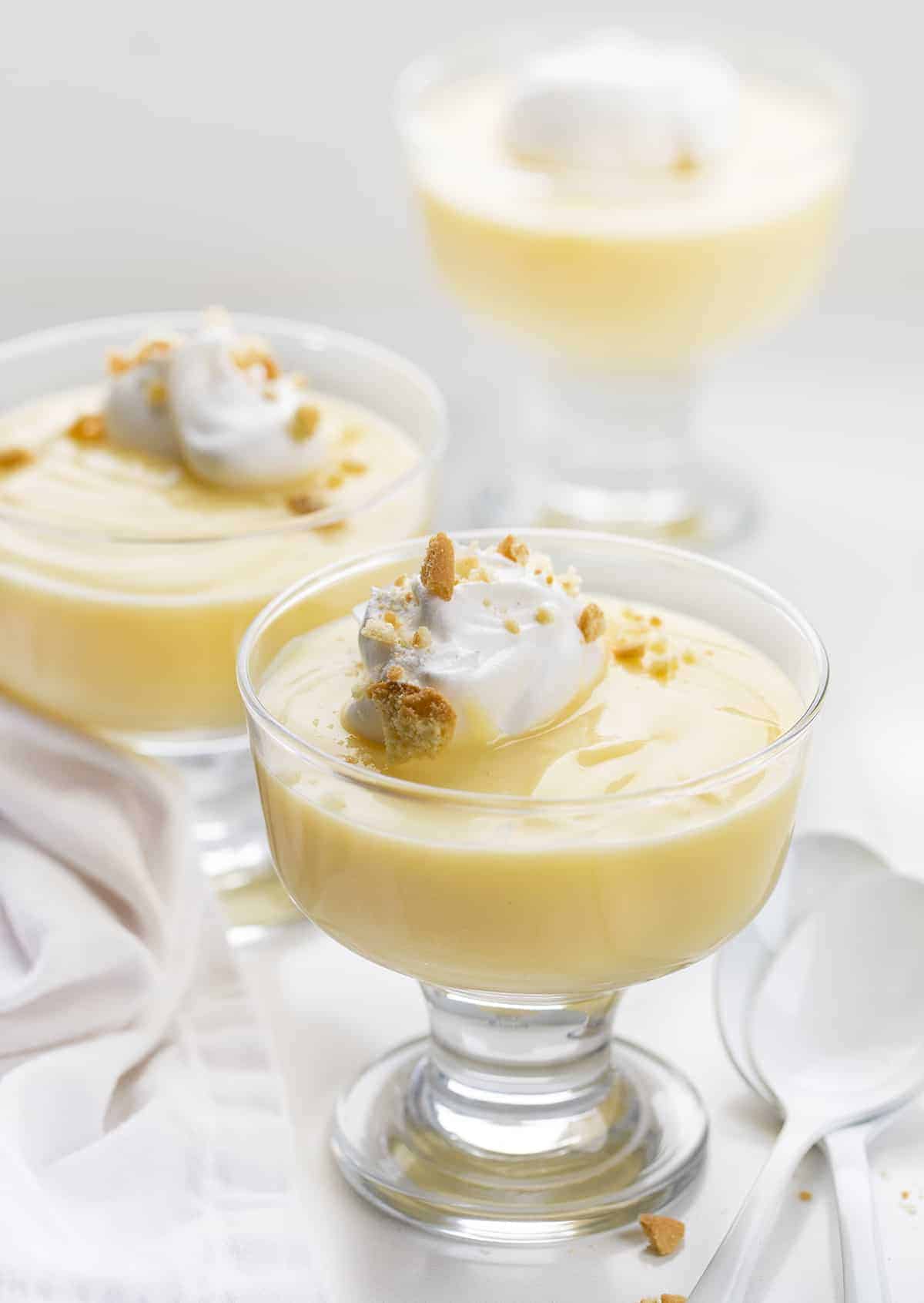 Three Glass Cups with Homemade Vanilla Pudding and Whipped Topping