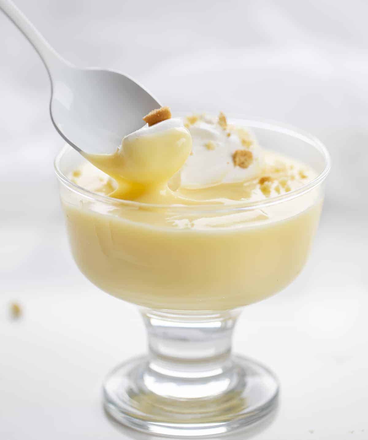 Spoon Taking a Bite of Vanilla Pudding