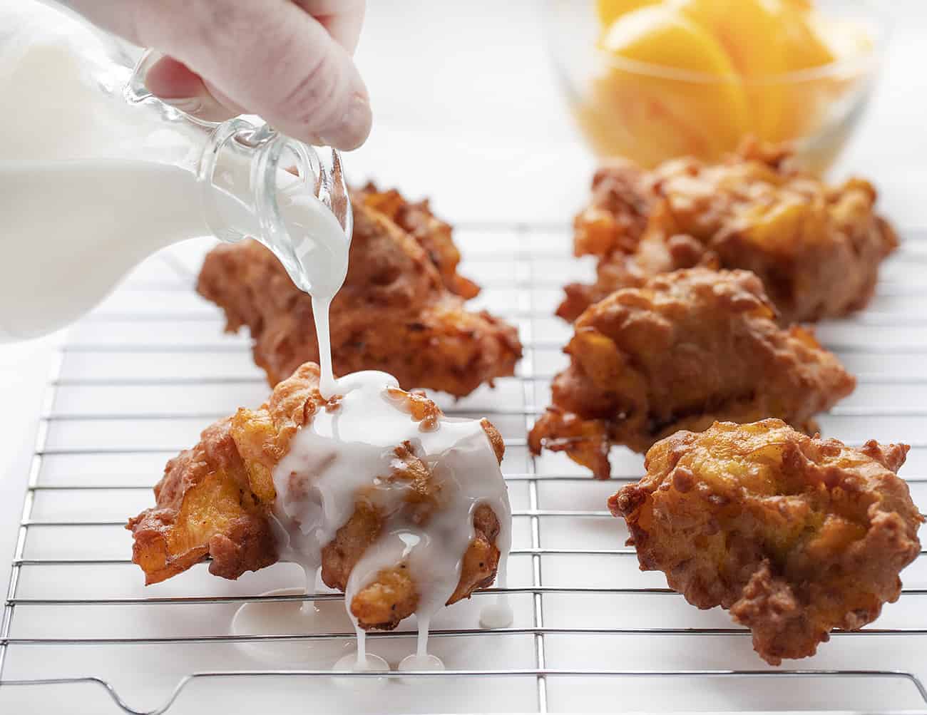 Pouring Glaze over Peach Fritters