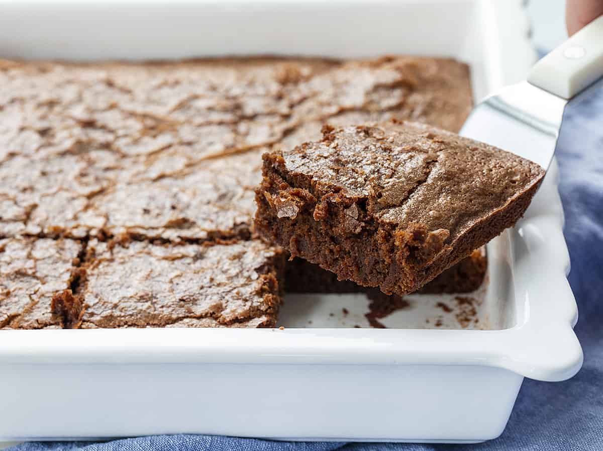 Picking up a Sourdough Brownie out of Baking Pan 