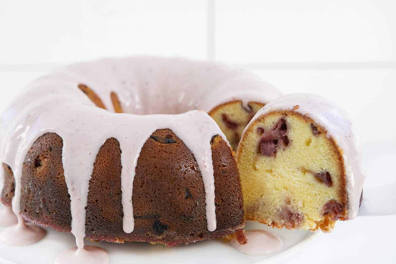 Strawberry Cream Cheese Pound Cake with Slice Being Removed