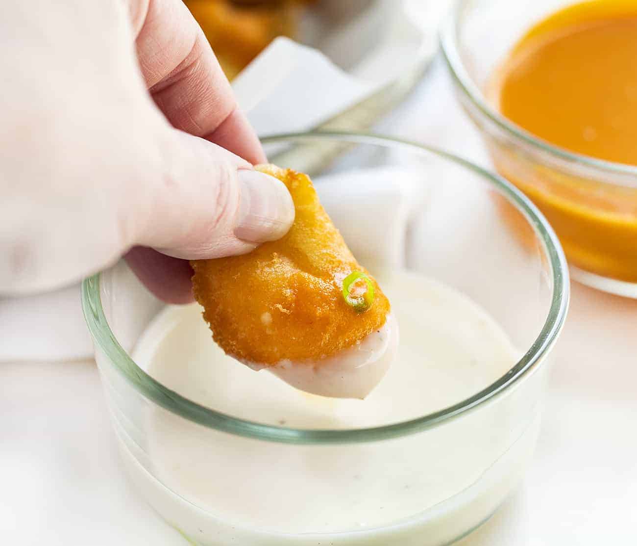 Dipping Buffalo Cheese Curd into Ranch Dressing