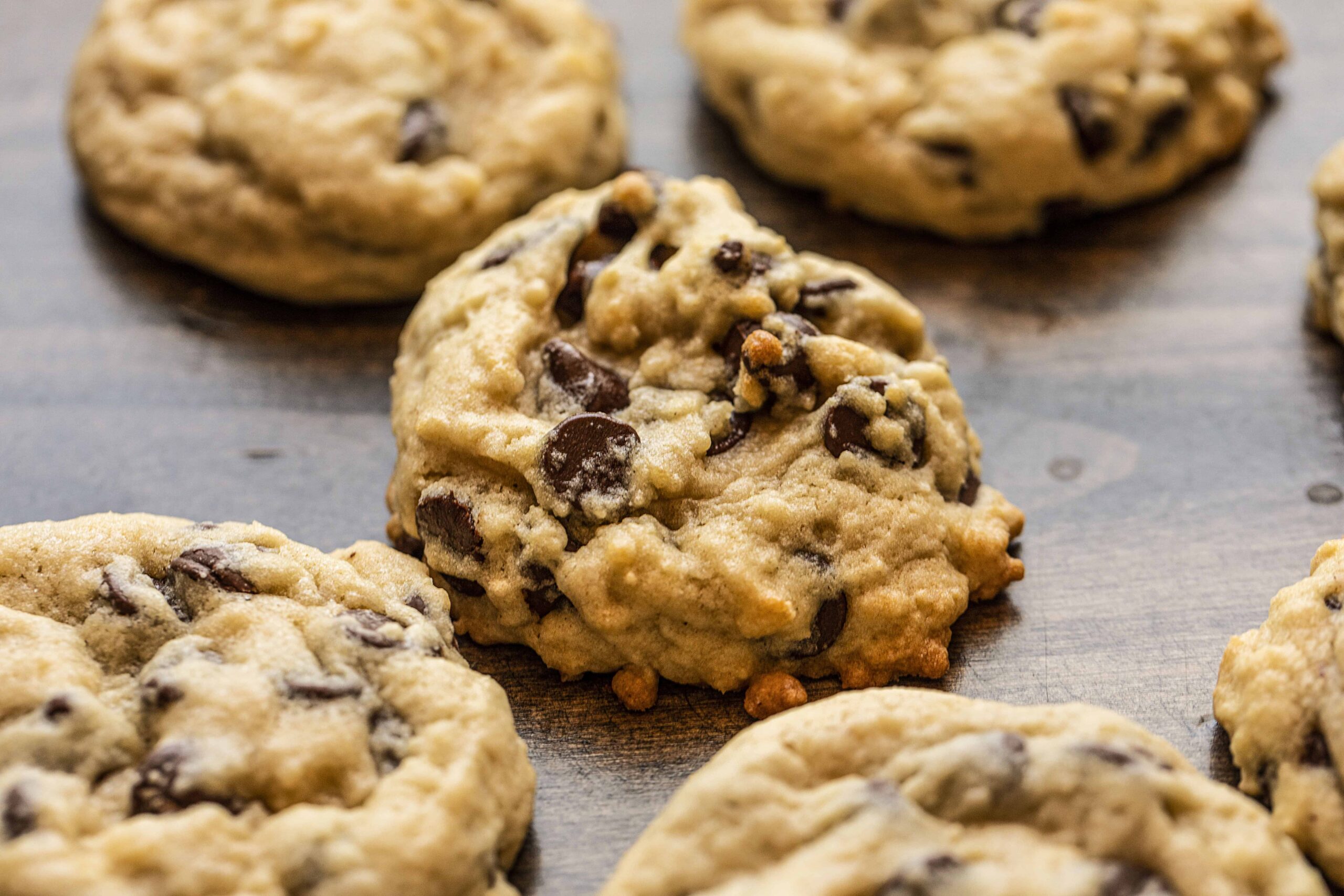 Close up of Chocolate Chip Loaded Sourdough Chocolate Chip Cookie on Wood Surface