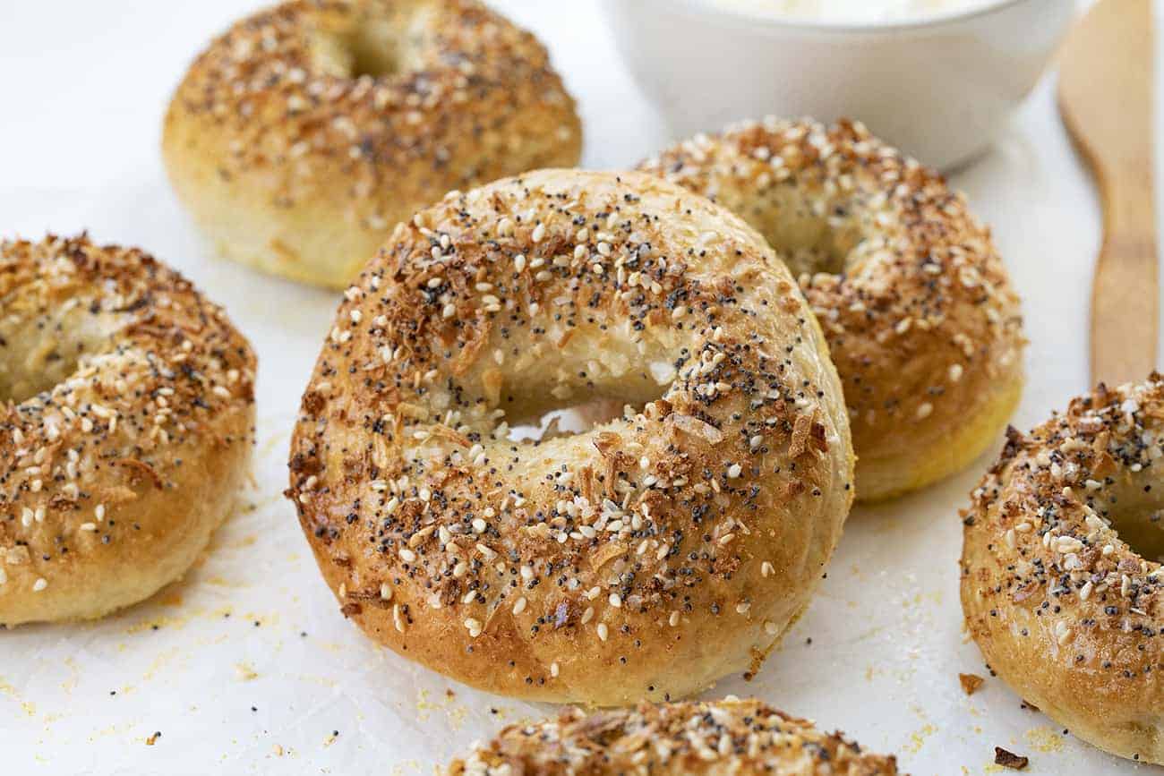 Baked Everything Bagels Laying on Parchment Paper