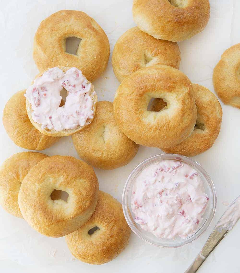 Overhead Image of Plain Bagels with Homemade Strawberry Cream Cheese in a Bowl and On a Bagel