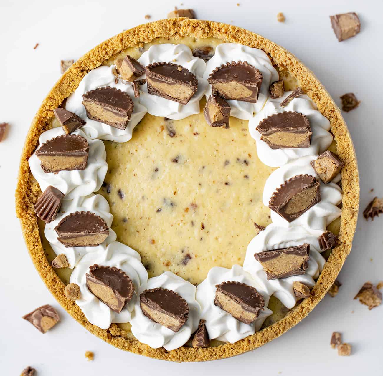 Overhead Image of Reese's Cheesecake with Peanut Butter Cup Pieces Scattered Around