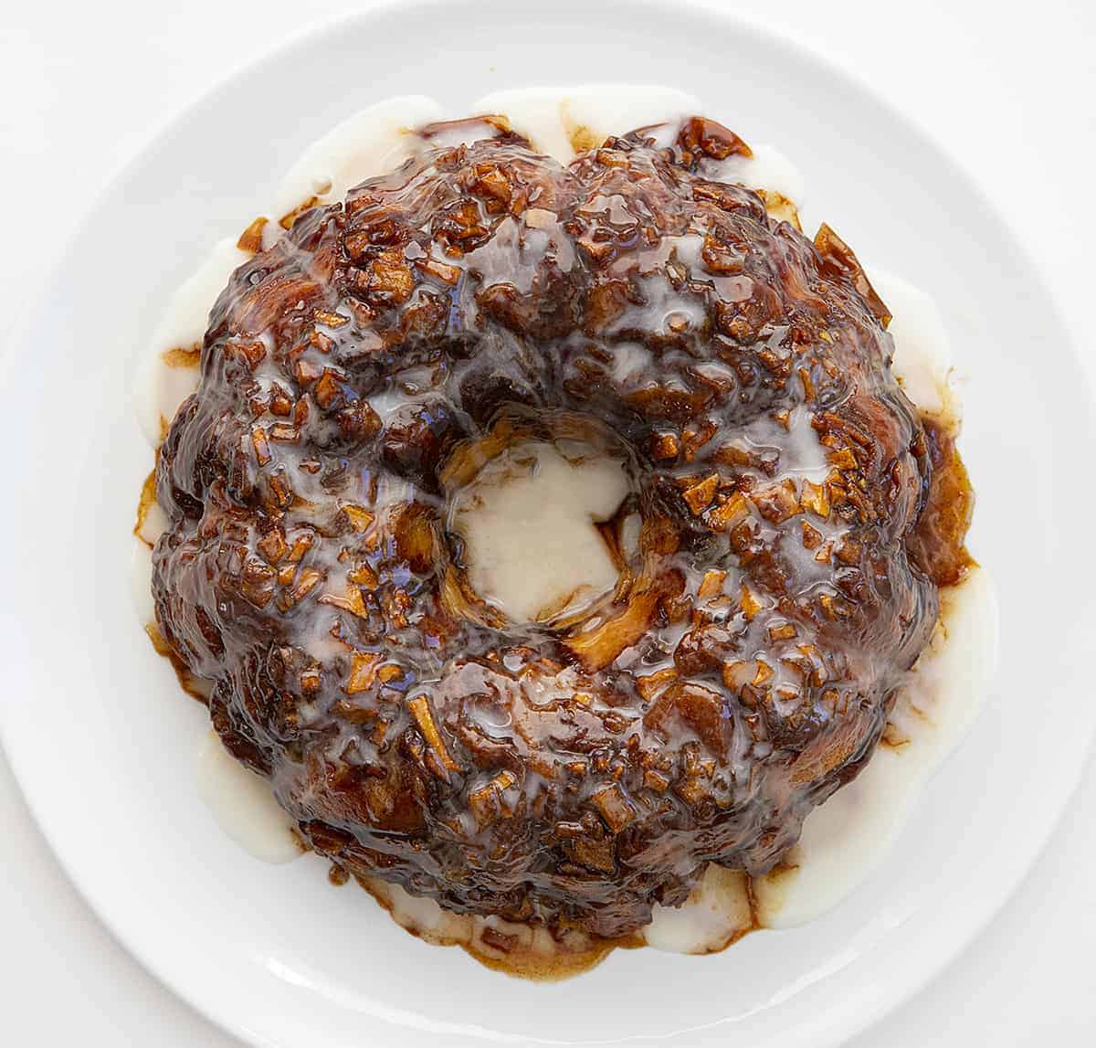 Overhead Image of Apple Fritter Monkey Bread on White Plate on White Surface