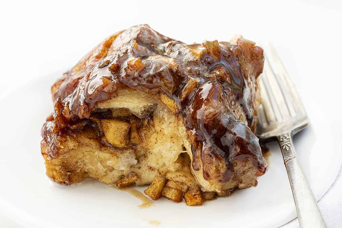 Piece of Apple Fritter Monkey Bread on Plate with Fork