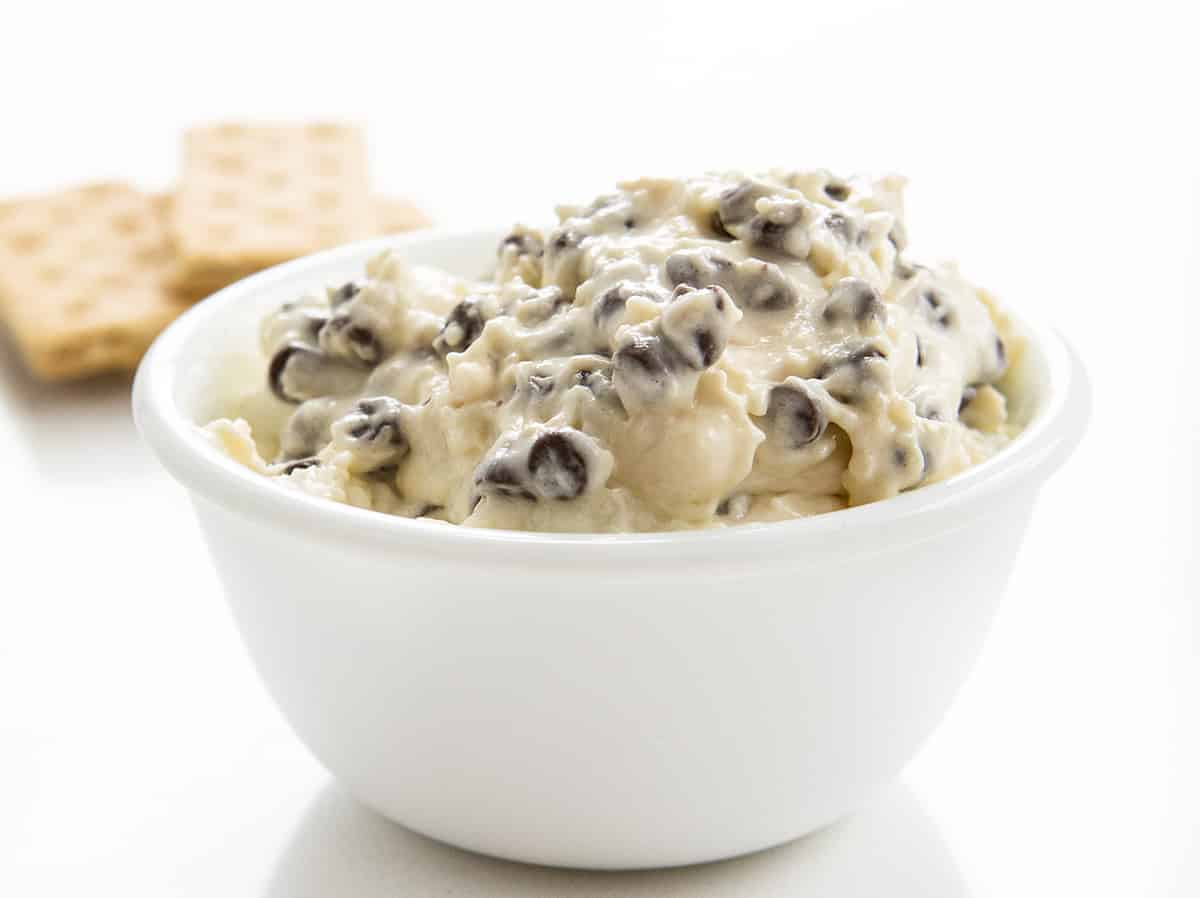 Chocolate Chip Dip - TikTok Booty Dip Recipe in a White Bowl with Graham Crackers in Back