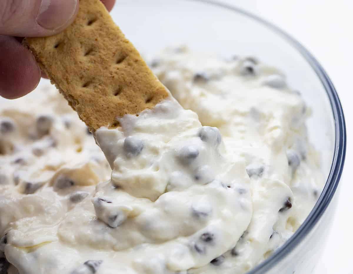 Dipping a Graham Cracker into Chocolate Chip Dip - TikTok Booty Dip Recipe