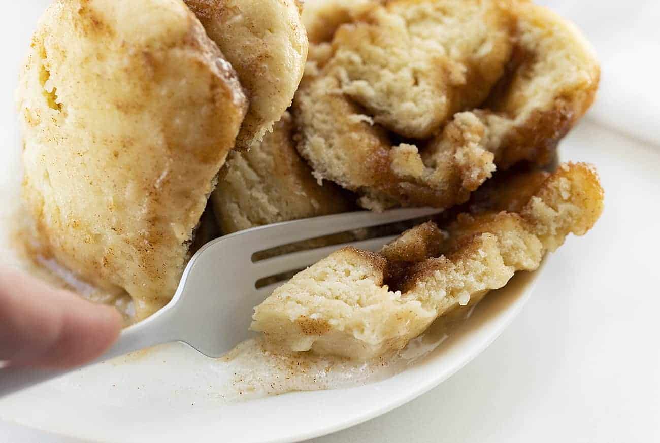 White Fork Taking Bite from TikTok Cinnamon Roll in a Mug