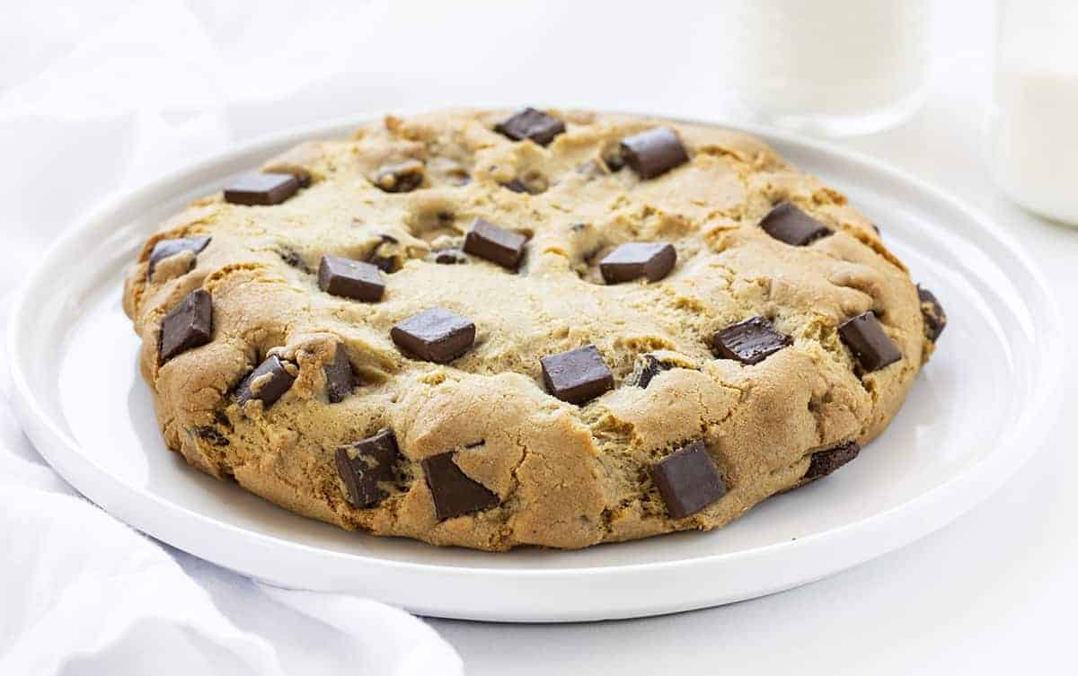 TikTok Giant Chocolate Chip Cookie on a White Plate with Milk