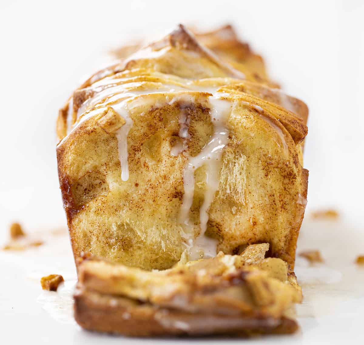 Apple Pull Apart Bread with One Piece Laying Down to Show Inside Texture