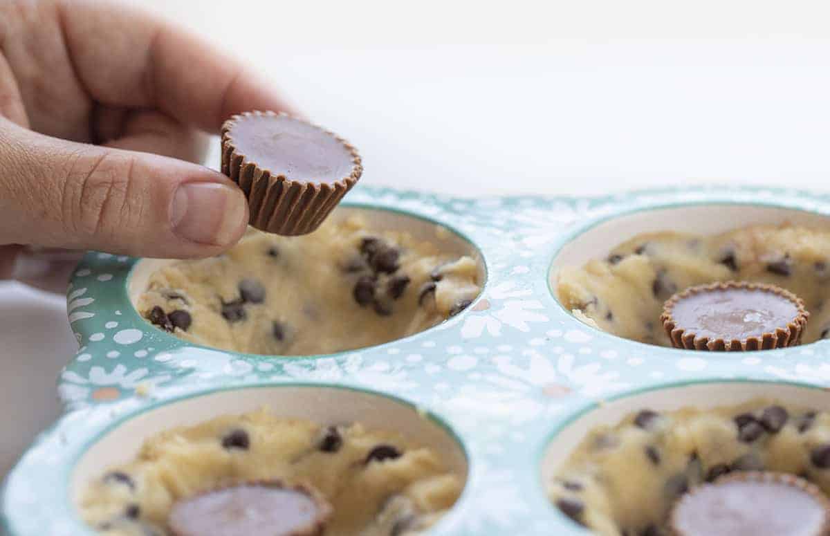 Adding Reese's Cup to Cookie Dough to Make Chocolate Chip Cookie Cups with Reese's Peanut Butter Cups
