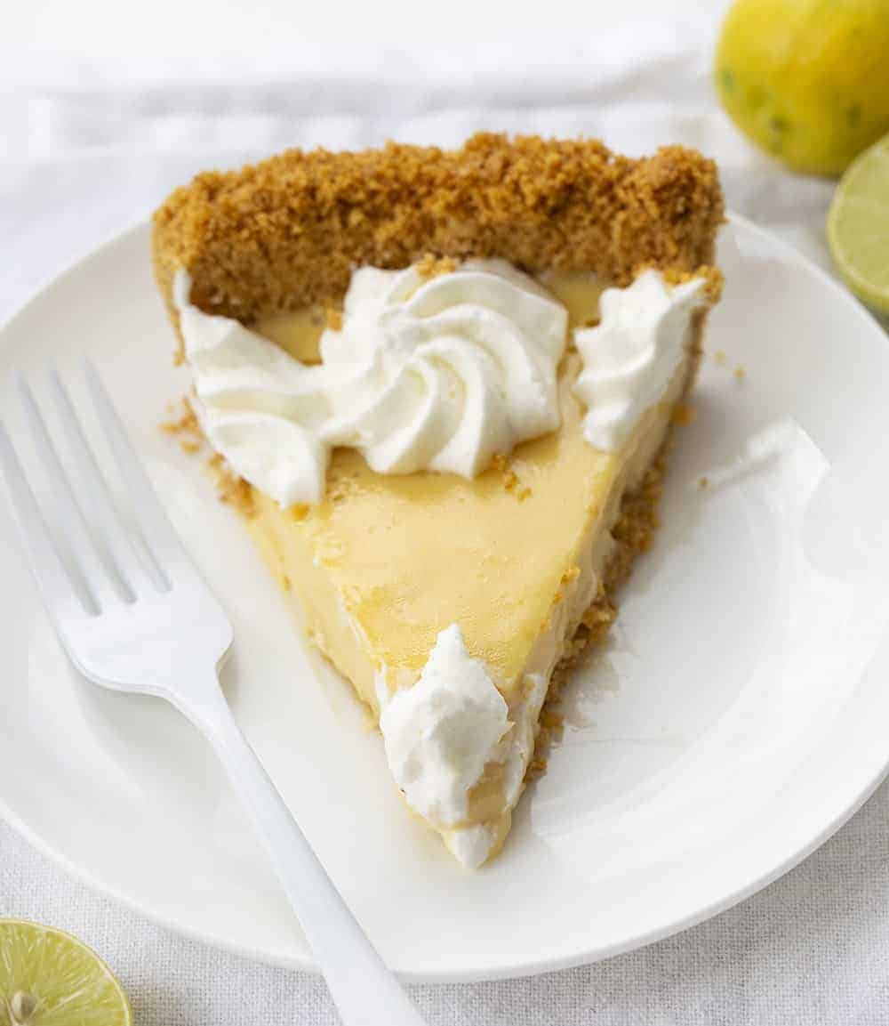 ONe Slice of Real Key Lime Pie on White Plate with White Fork