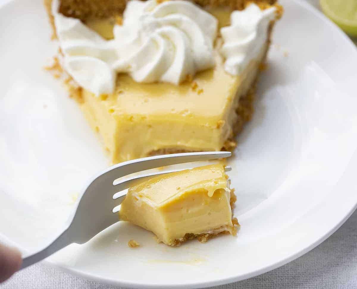 Fork Taking Out a Bite of Key Lime Pie