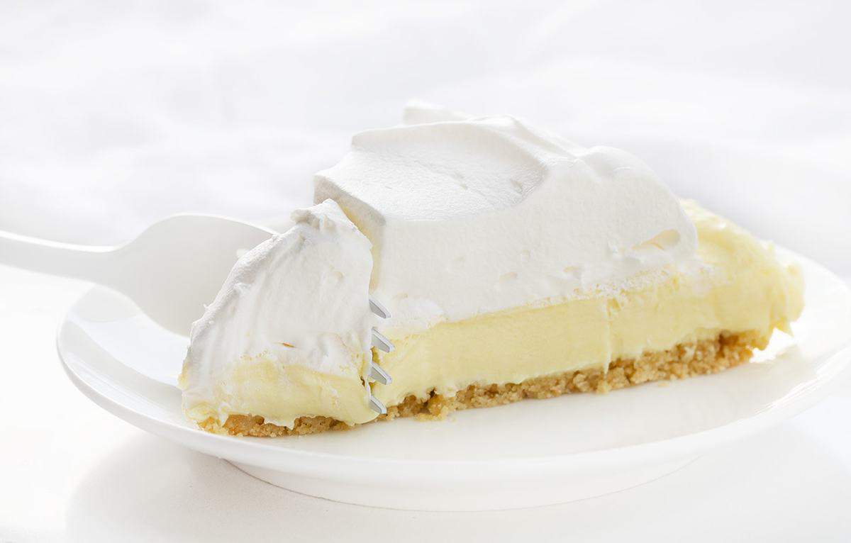 Fork Cutting into one Piece of Lemonade Pie