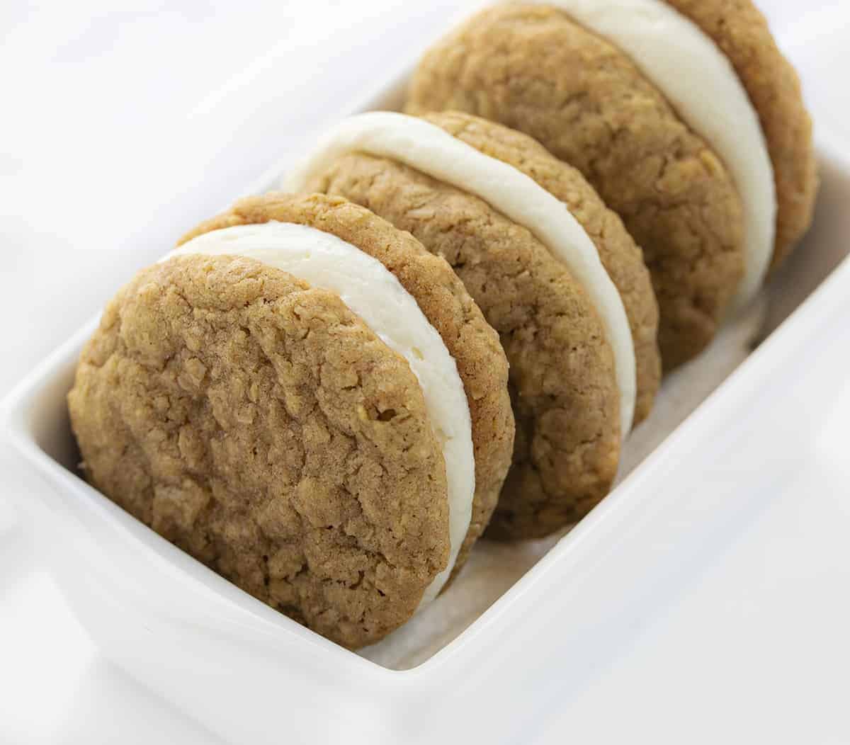 Oatmeal Cream Pie Cookies Stacked in White Ceramic Dish