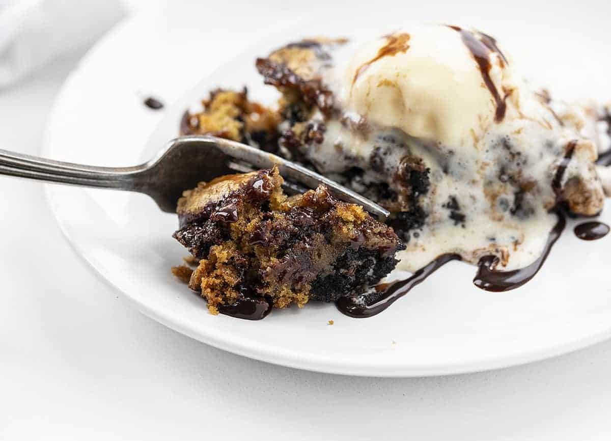 Fork Taking Bite of Skillet Chocolate Chip Candy Cookie