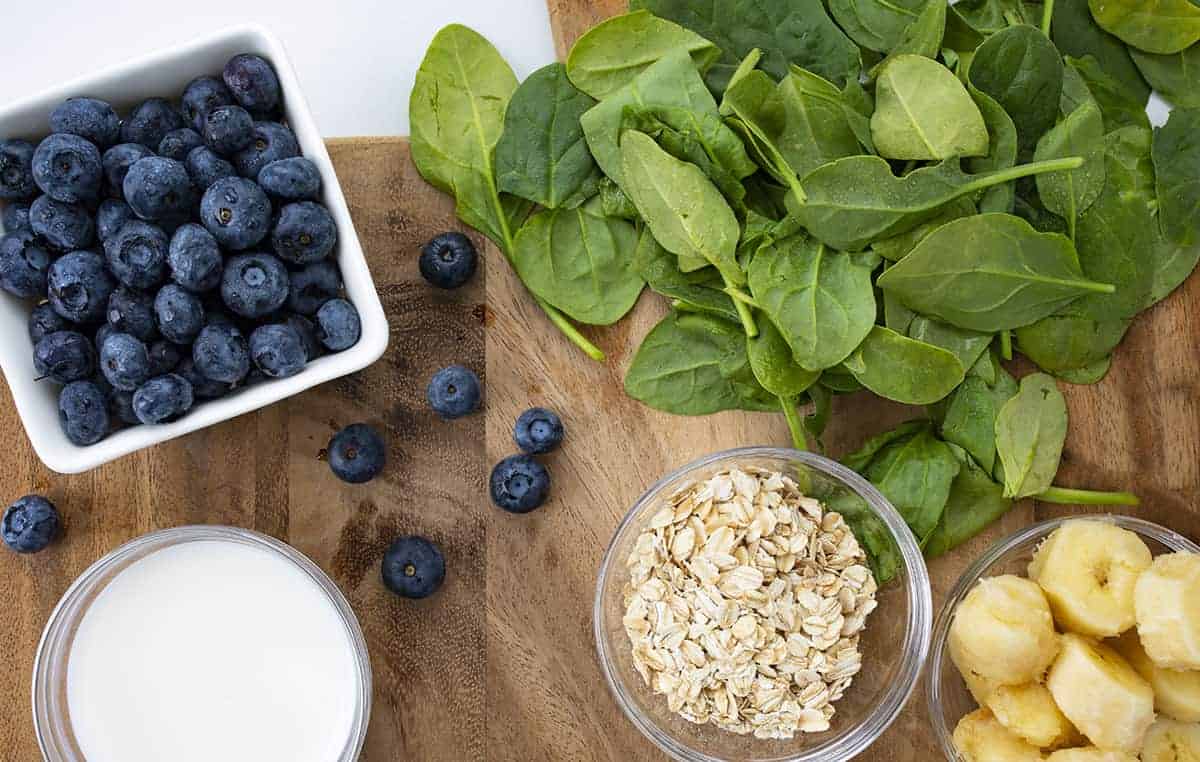 Raw Ingredients for Blueberry Spinach Breakfast Smoothie on Cutting Board