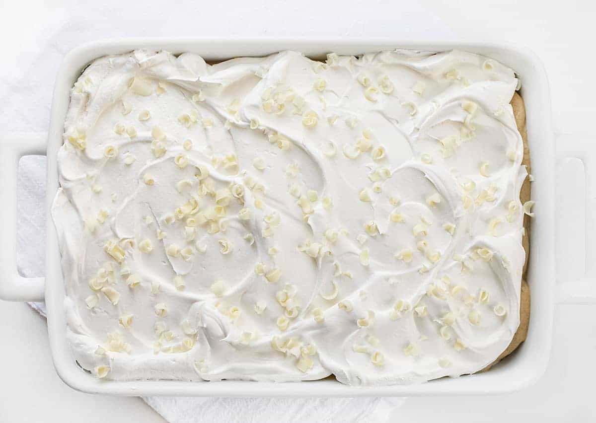 Overhead View of Golden Oreo Dessert in White Baking Pan with Mini White Chocolate Curls