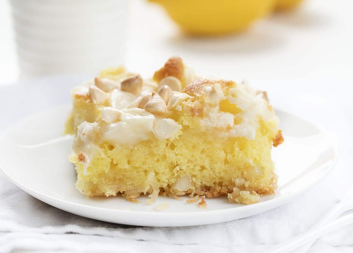 One Slice of Lemon Earthquake Cake on White Plate