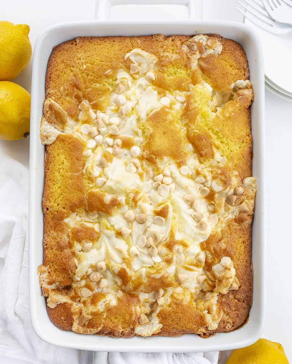 Overhead of Lemon Earthquake Cake in White Pan with Lemons