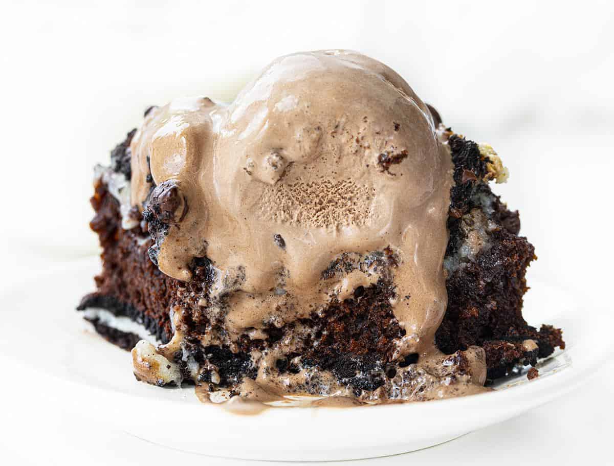 Oreo Earthquake Cake on White Plate with Chocolate Ice Cream