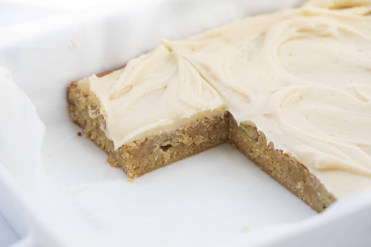 Ooey Gooey Banana Bars with Salted Caramel Frosting in Pan with 5 bars Removed