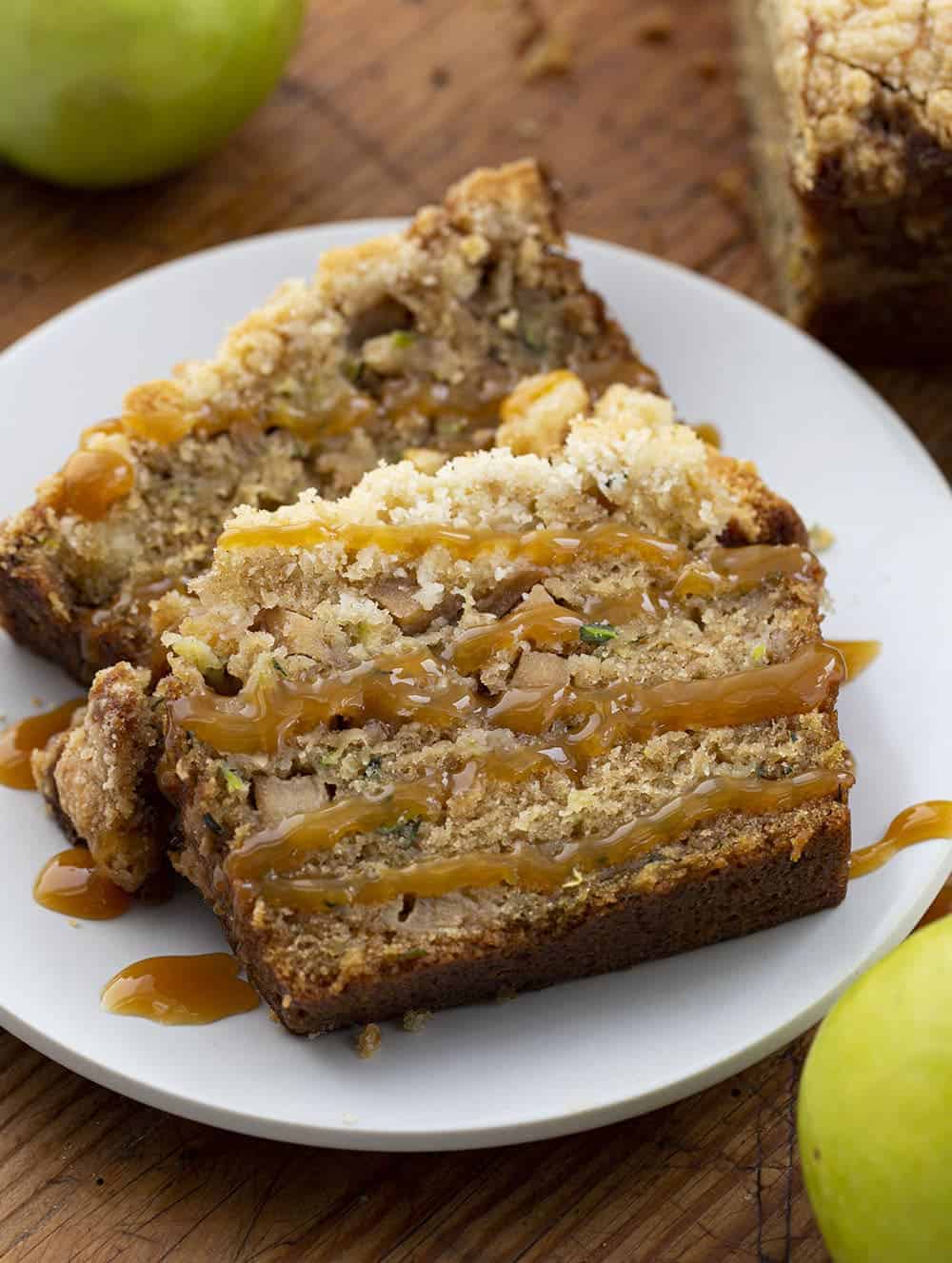 Two Pieces Apple Zucchini Bread on a Plate Drizzled with Caramel