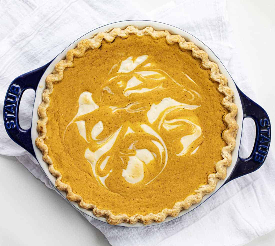 Overhead Image of Pumpkin Cream Cheese Pie on White Surface