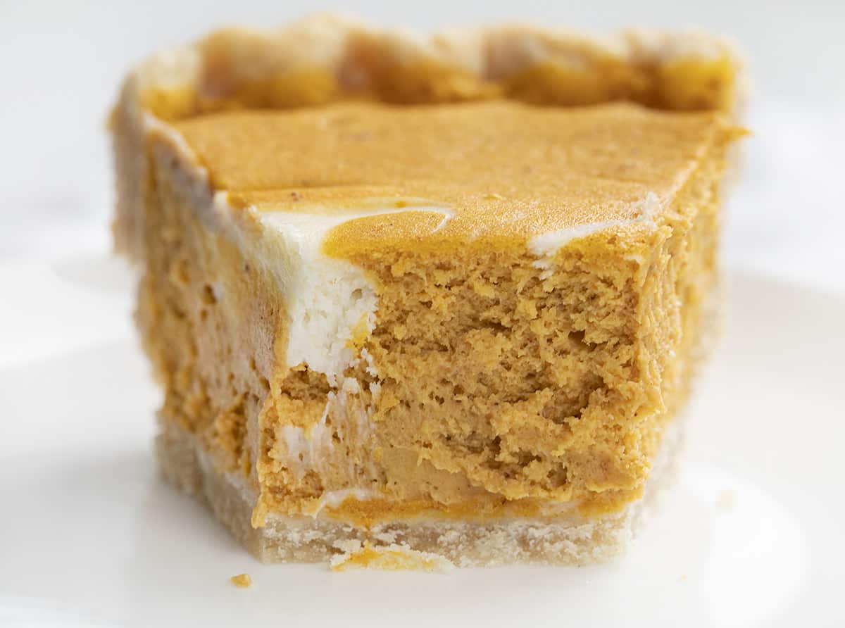 Pumpkin Cream Cheese Pie Slice with Bite Removed Showing Inside Texture