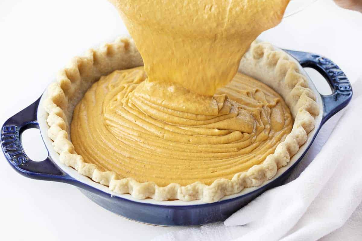 Pouring Filling into Homemade Pie Crust