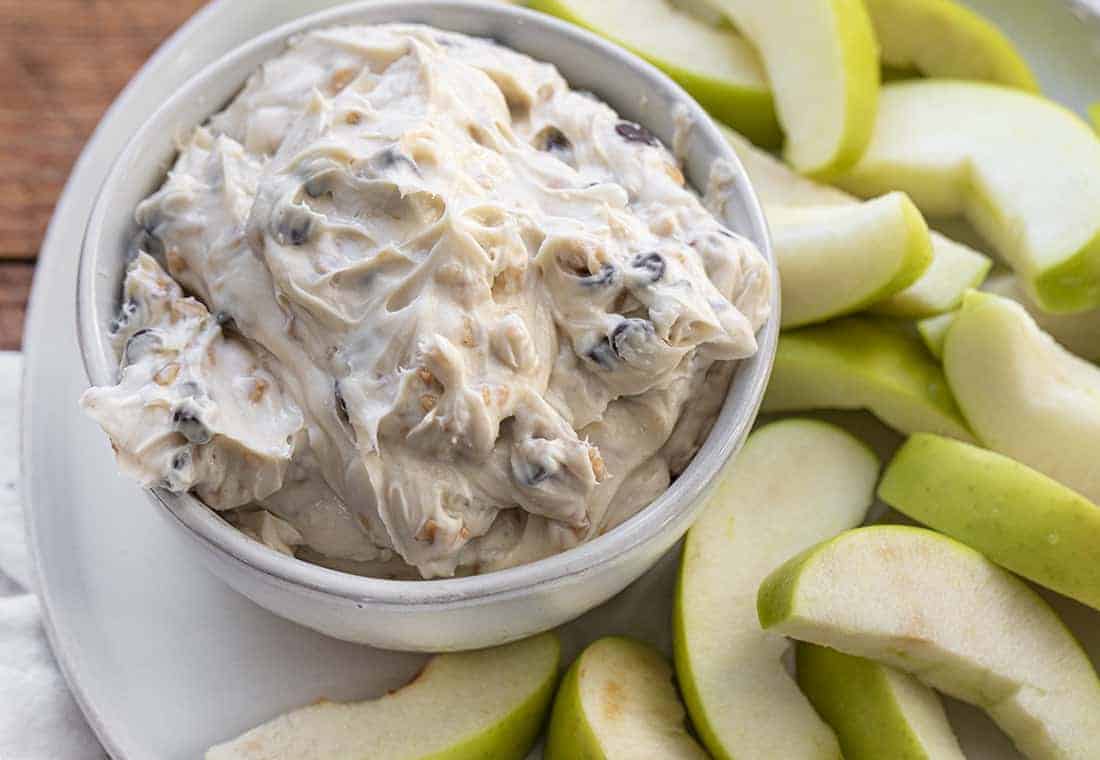 Bowl of Apple Toffee Dip on Plate with Apple Slices