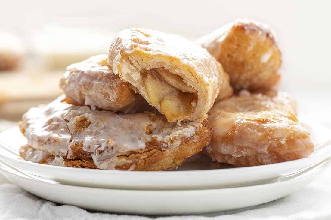 Apple Hand Pies on Plate with One Bit Into