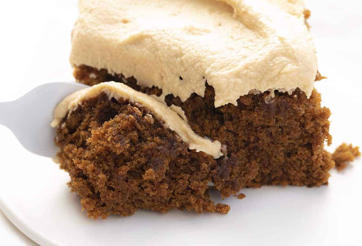 Fork Taking a Bite of Gingerbread Cake with Salted Caramel Frosting