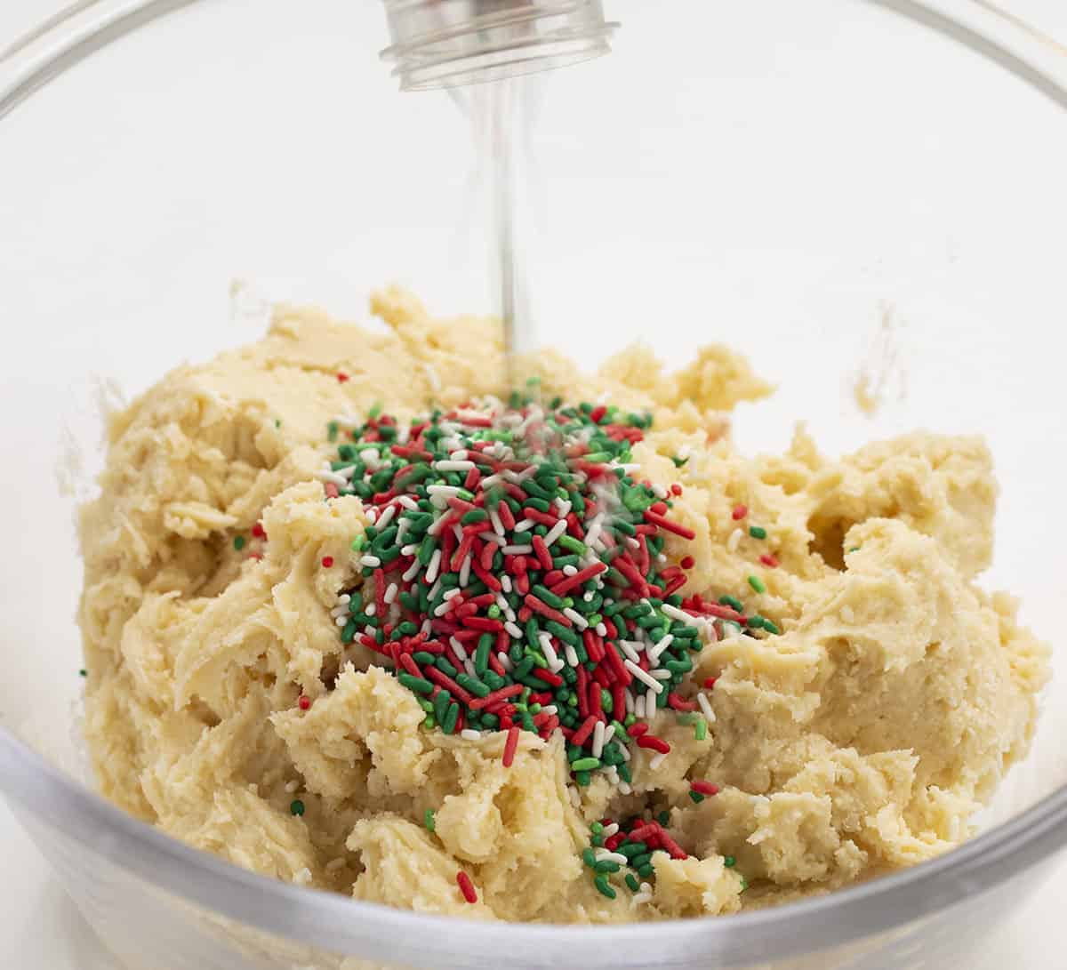 Christmas Ooey Gooey Cookie Batter Getting Sprinkles Added