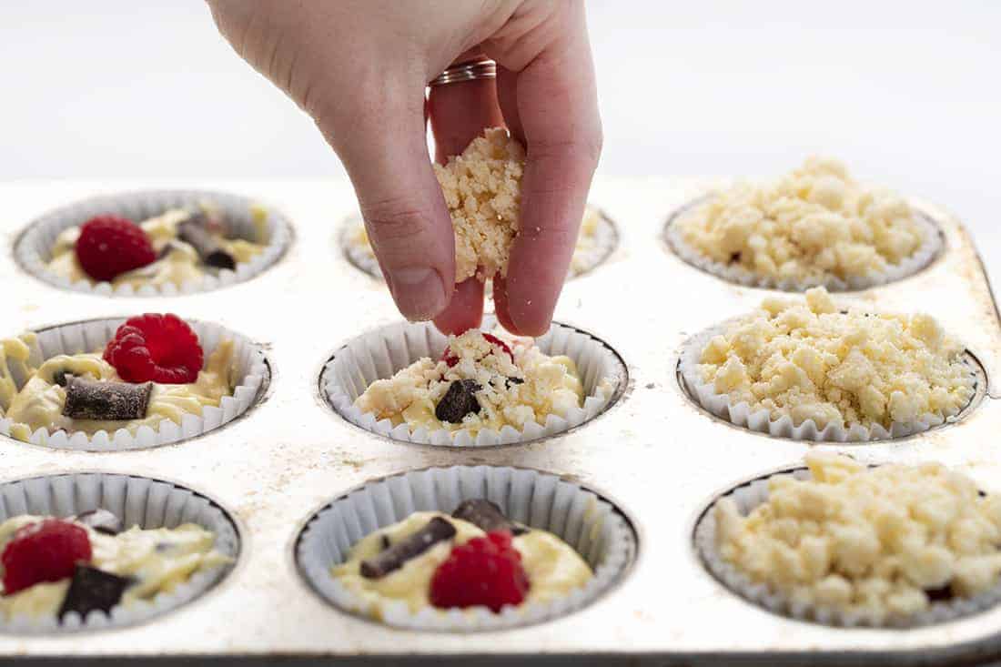 Adding crumble to Raspberry Chocolate Muffins