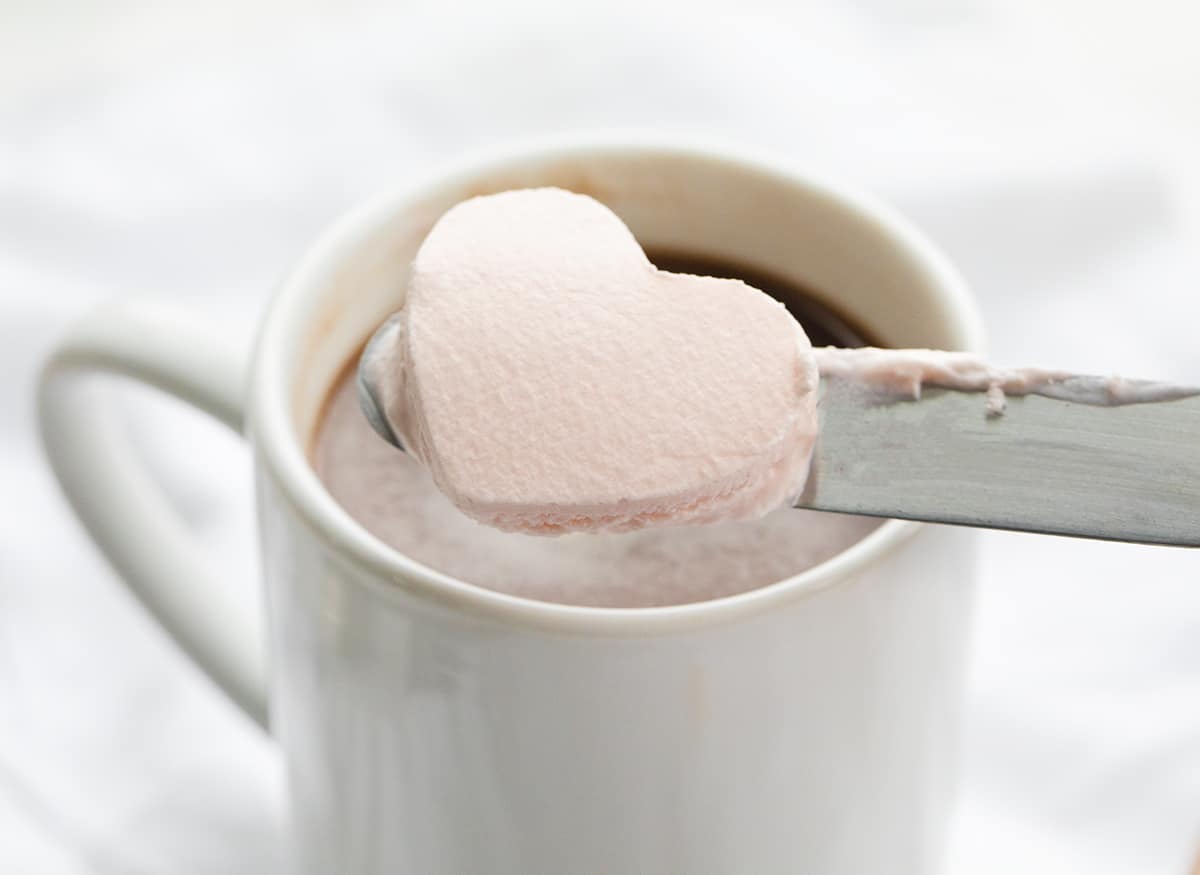 Whipped Cream Heart Being Added to Hot Chocolate