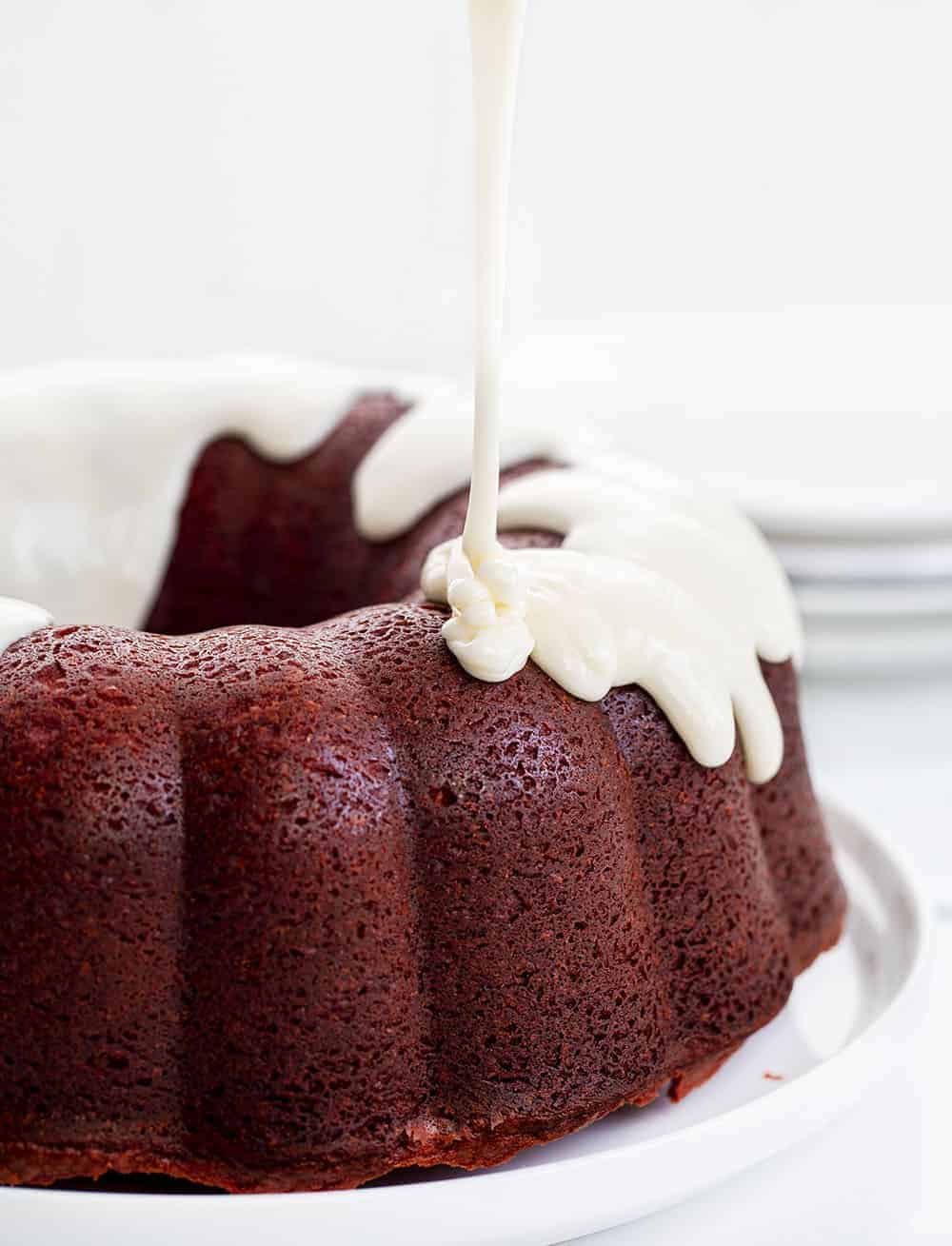 Pouring Glaze over Red Velvet Pound Cake 