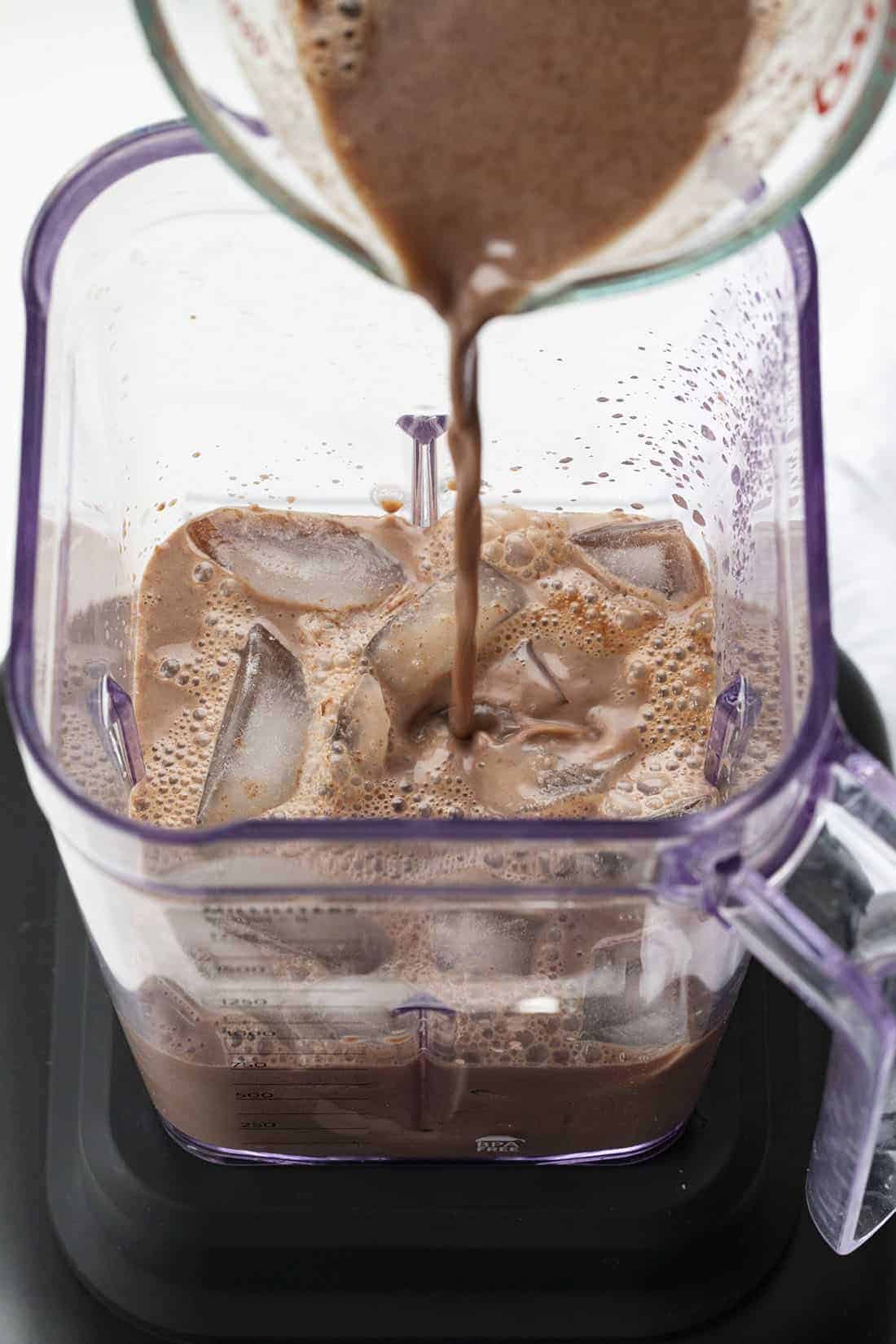 Adding Ingredients to Blender for Frozen Hot Chocolate Drink