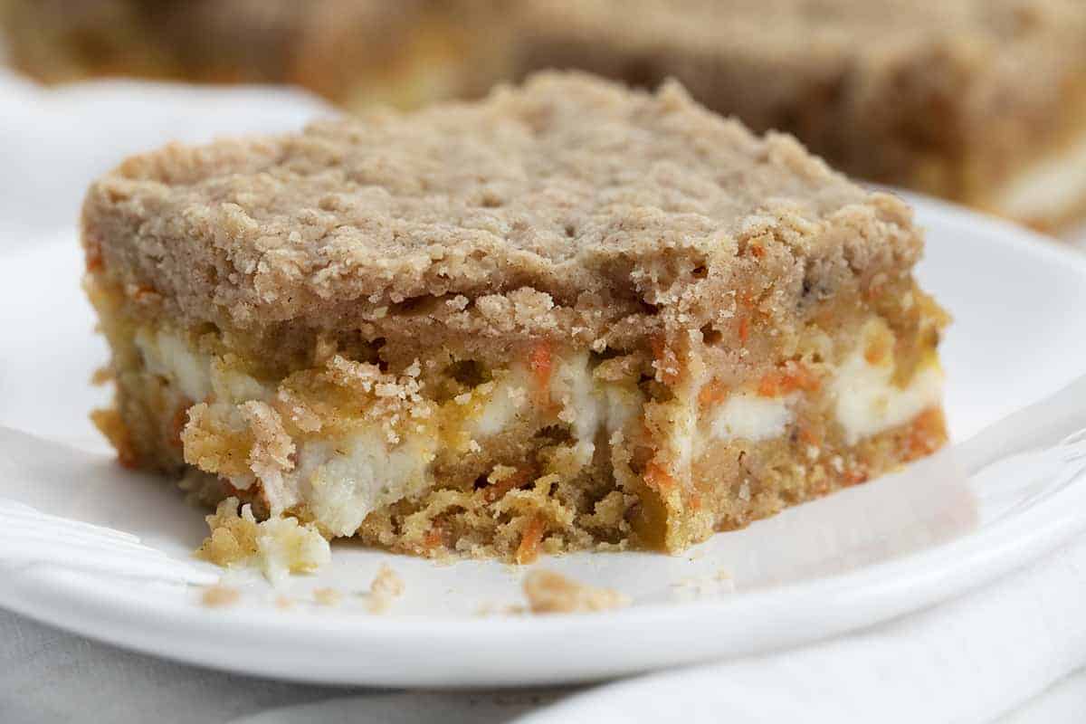 Carrot Cake Bars with Bite Missing on Plate