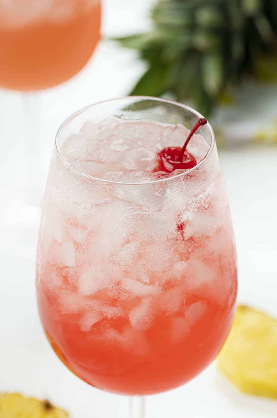 Tropical Champagne Cocktail with Cherries