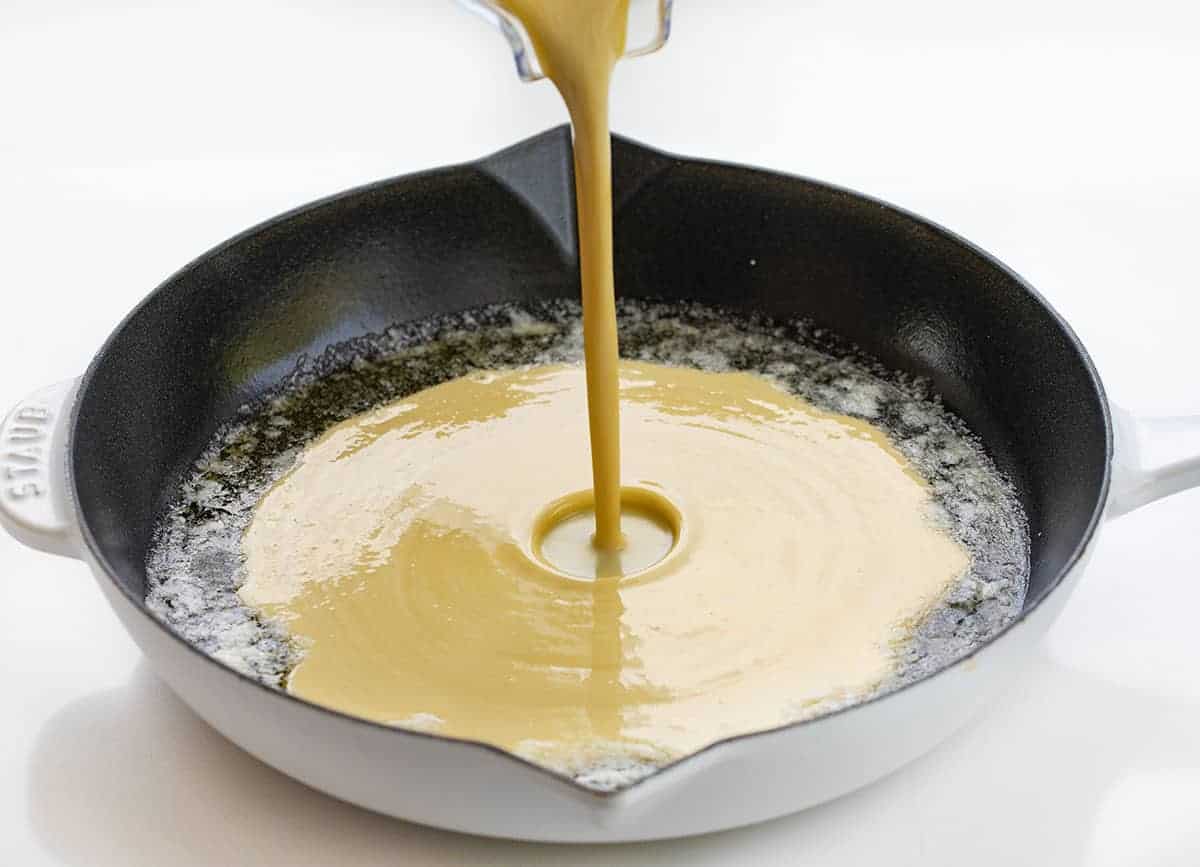 Pouring Dutch Baby Pancake Batter into Hot Pan
