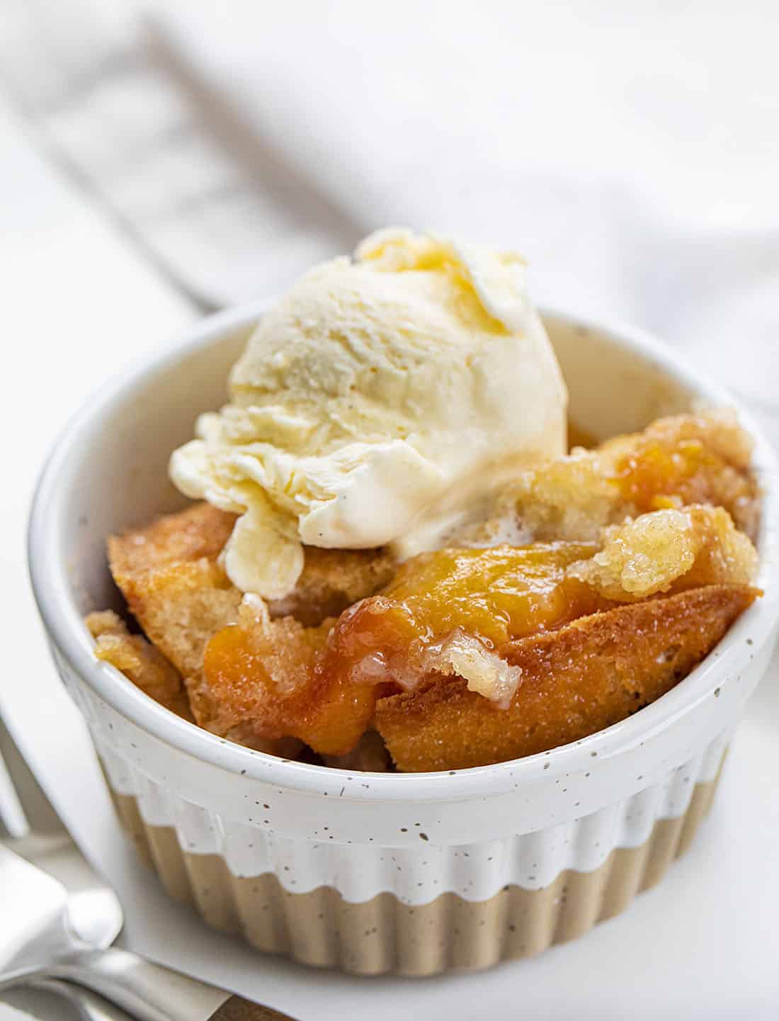 Bowl of Peach Skillet Cake