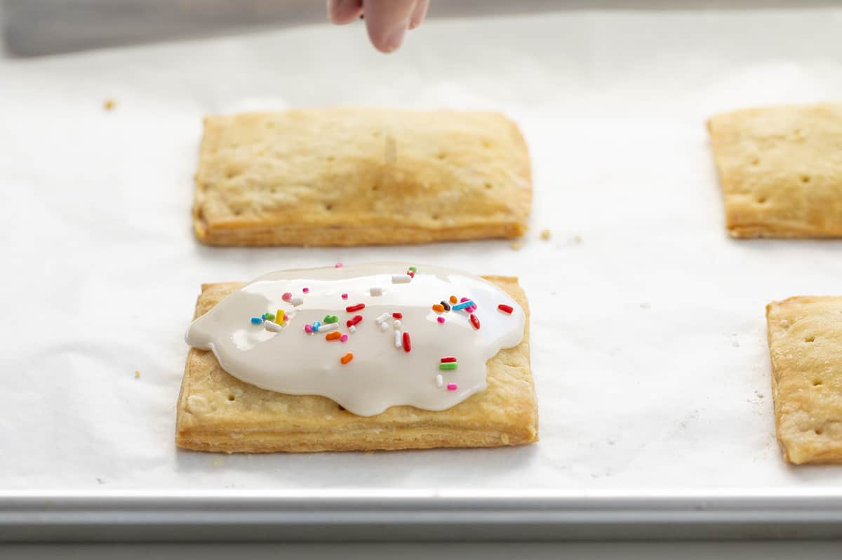 Adding Frosting and Sprinkles to Strawberry Pop Tart