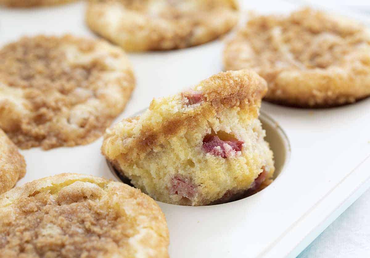 Rhubarb Streusel Muffins in Pan with One Almost Out.