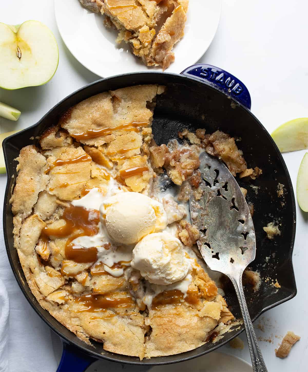 Swedish Apple Pie with Ice Cream and Some Pieces Removed.