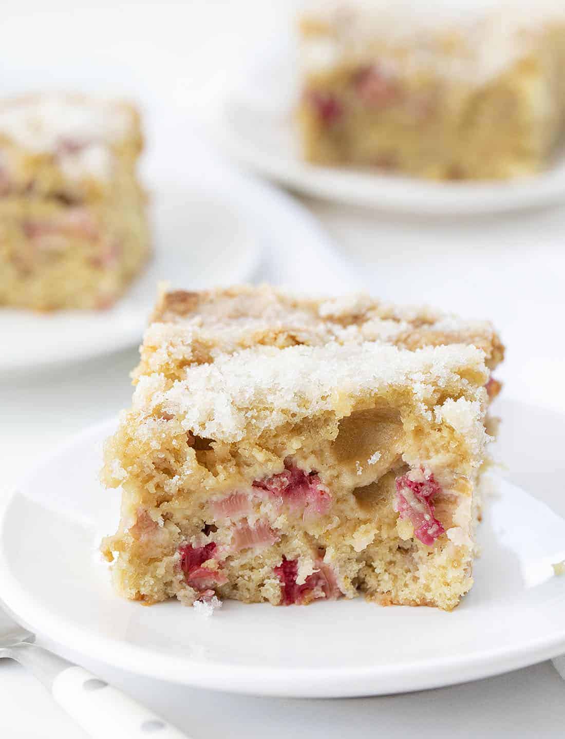 Pieces of Rhubarb Cake on White Plates